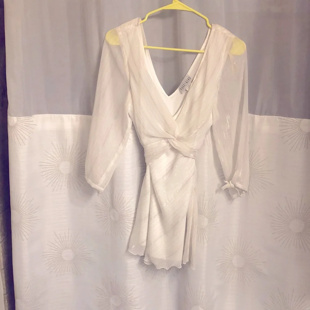 White and shimmery silver blouse with low v-neck. - Picture 1 of 3